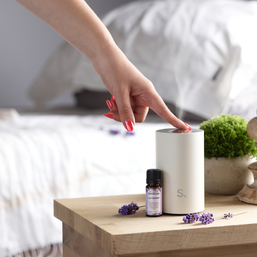 waterless diffuser, being turned on, bed in background